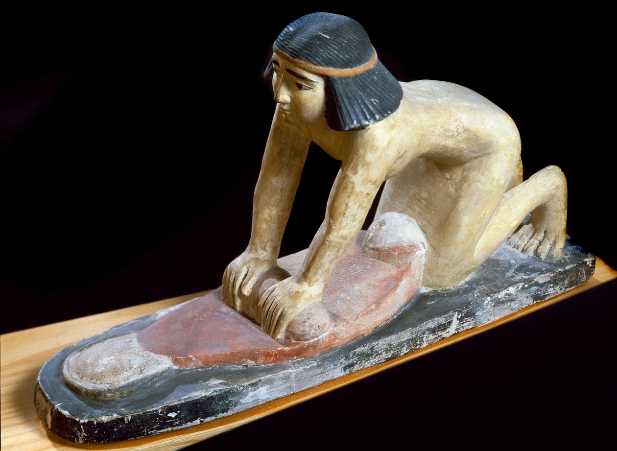 Egyptian antiquity: Egyptian crushing cereals to make bread. Figurine by Egyptian 5th Dynasty