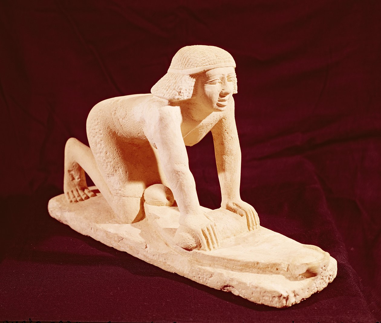 Model of a servant grinding grain, Old Kingdom, from Saqqara by Egyptian 5th Dynasty