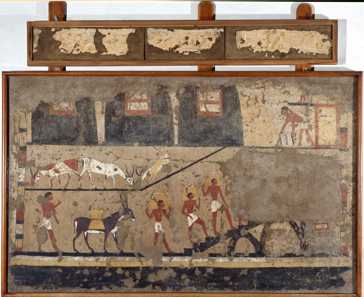 Egyptian antiquity: the transport of wheat on the back of mules and on the back of men. Detrempe on clay and straw from the tomb of the General and Chancellor of King Iti in El Ghebelen near Luxor. 2200-2000 BC. Turin, Egyptian Museum by Egyptian Egyptian