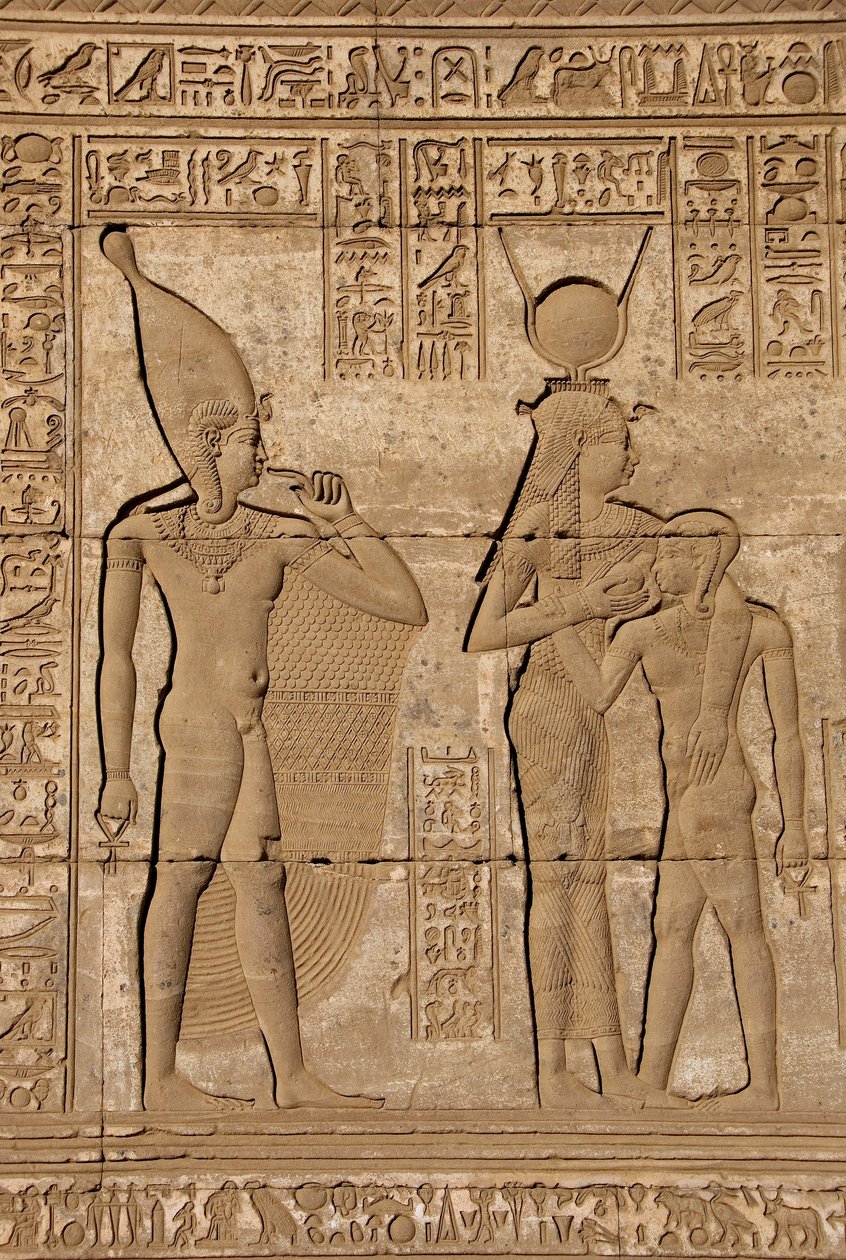 Egyptian Antiquity: Roman Mammisi Commemorating the Birth of Ihy, Son of Hathor - Detail of Reliefs and Hieroglyphs: the Goddess Isis - Hathor Nursing Her Son Ihi (Ihy) and Behind Her Another Image of Ihi with a Finger in Her Mouth Indicating that it is a  by Egyptian Ptolemaic Period