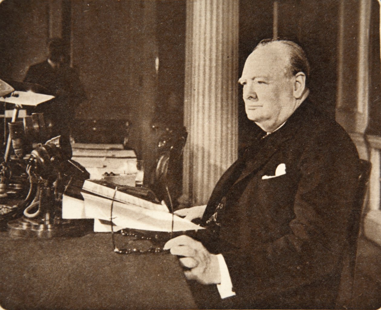 Advance, Britannia! Long live the cause of Freedom! God save the King!: Mr. Winston Churchill seated at the microphone on VE Day, when he announced to the nation that the war with Germany was at an end by English Photographer