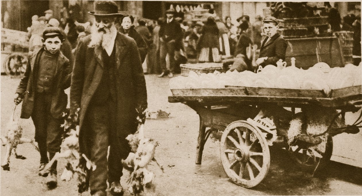A Jewish old man and his grandson carrying some fowls from Wentworth Street, Stepney by English Photographer