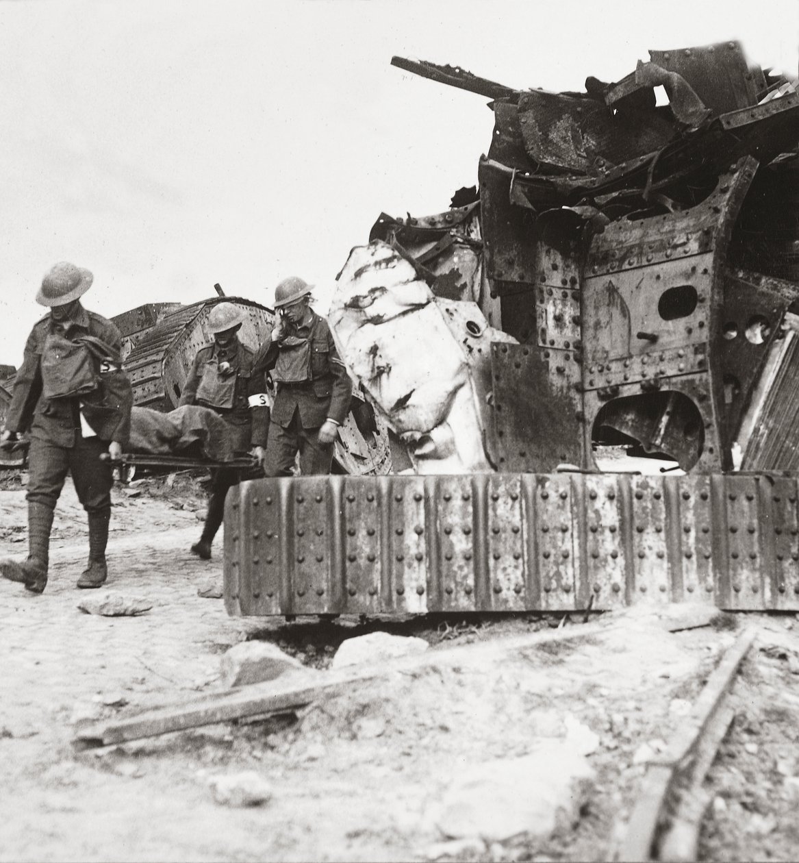Casualties coming back from the line, pass tanks wrecked in Battle of the Tanks, Villers-Bretonneux, 24th April 1918 by English Photographer