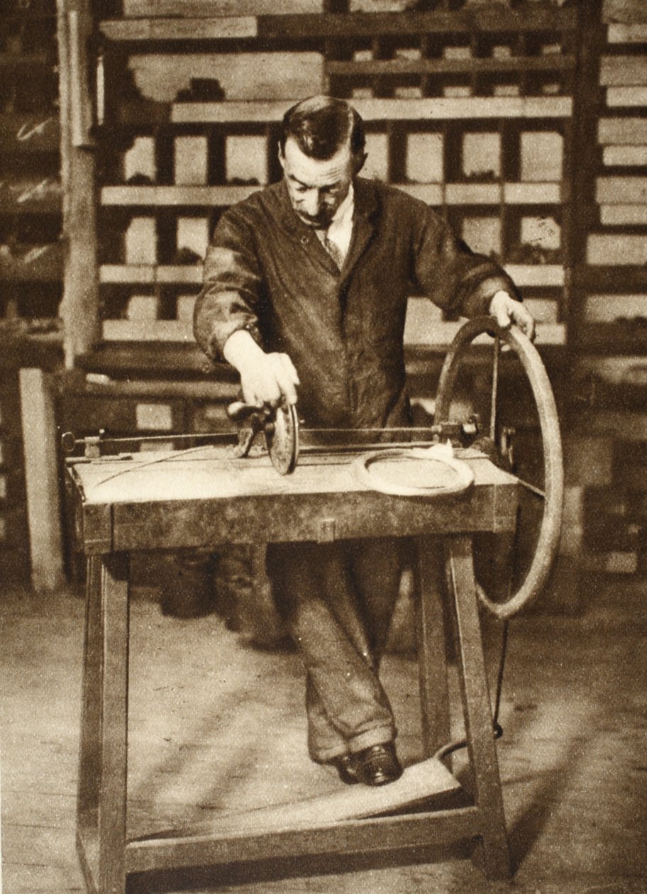 Locksmith winding wire into springs, from Wonderful London, published 1926-27 by English Photographer
