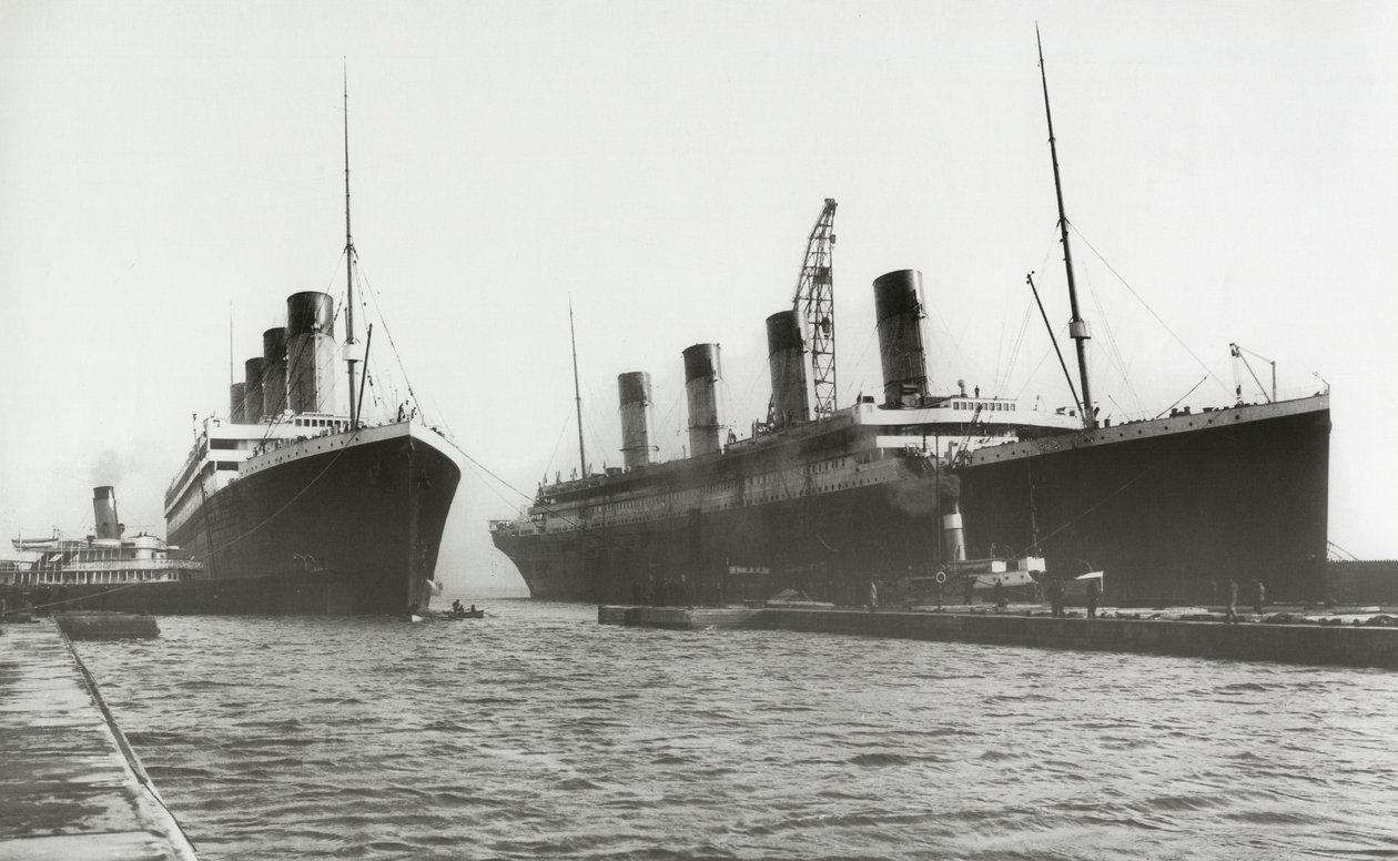 RMS Titanic being moved out of drydock to allow her sister ship, RMS Olympic, to have a propeller replaced, March 6, 1912 by English Photographer