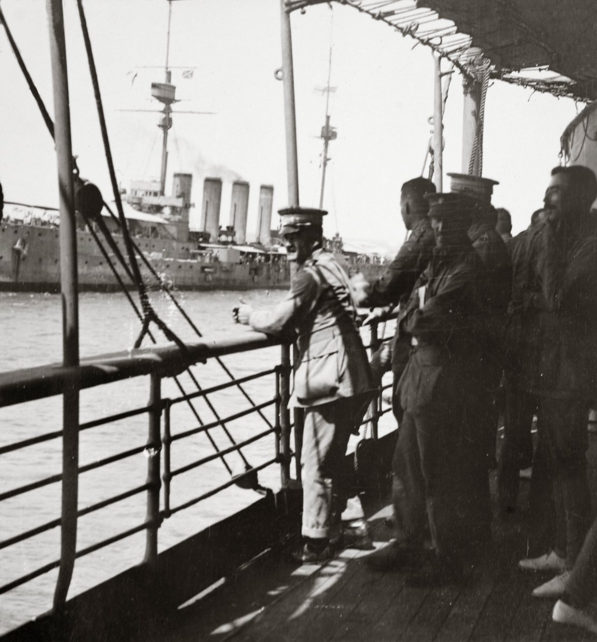 Transport with the Old Contemptibles from India meets a man-of-war in the Mediterranean by English Photographer