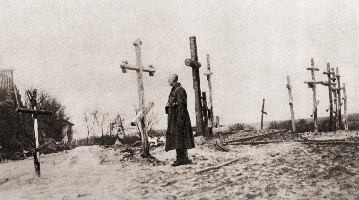 A Russian Soldier at the Grave of a Comrade-in-Arms During World War One, from The Illustrated War News, 1915 by English Photographer