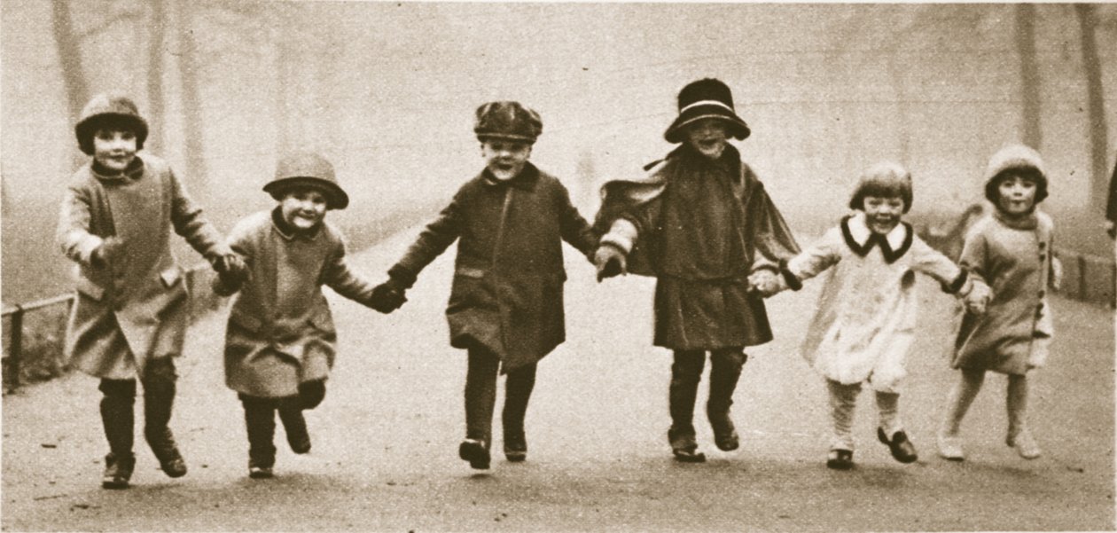 A line of well-dressed children running in Hyde Park, from Wonderful London, published 1926-27 by English Photographer