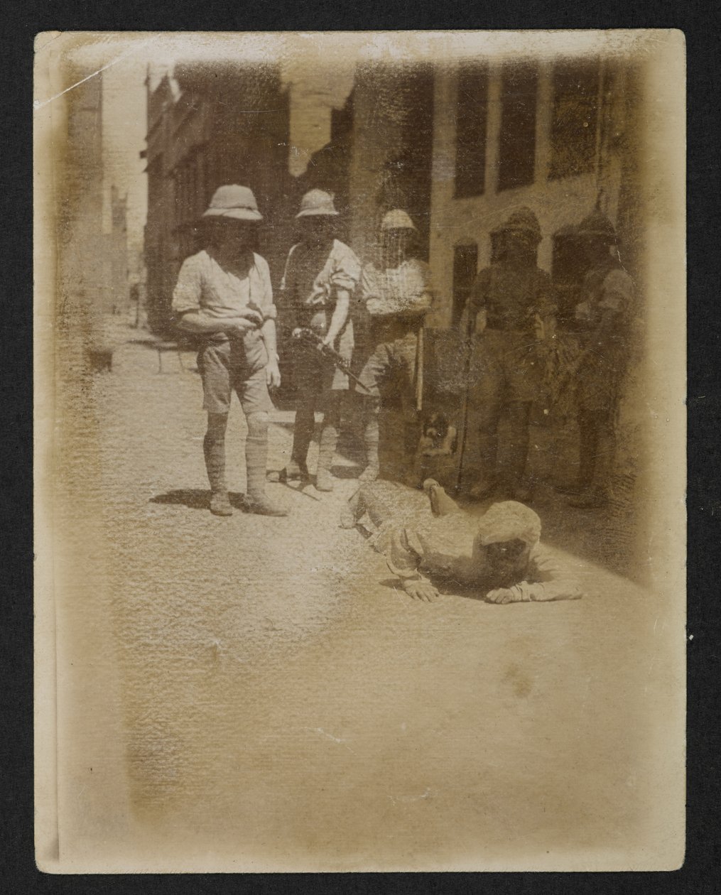 A prisoner under armed guard at Ram Bagh garden, from Views of Amritsar, including the aftermath of the riots by English Photographer