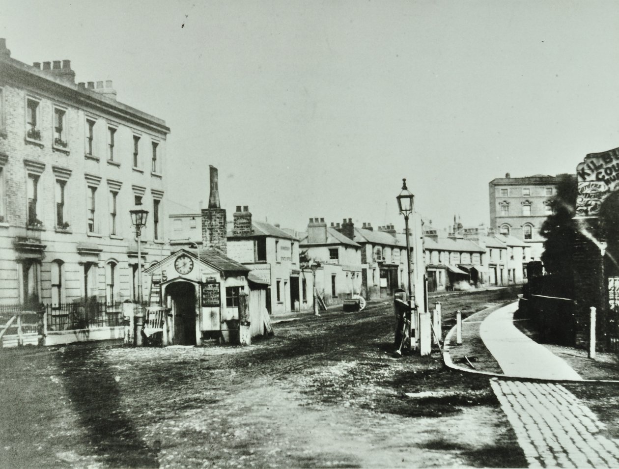 Kilburn Toll Gate at south end of Kilburn High Road by junction of Kilburn Priory, Camden Libraries by English Photographer