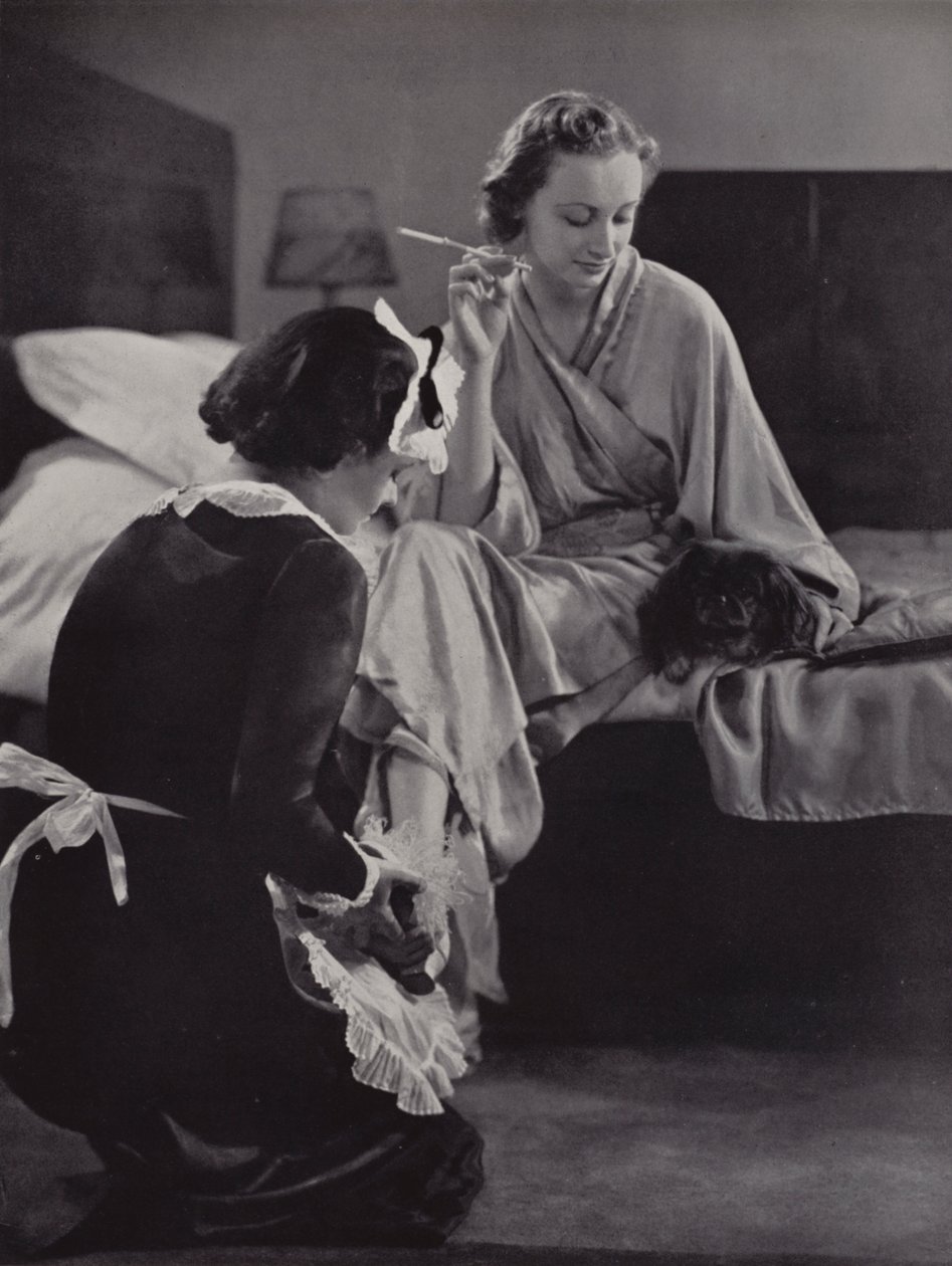 Woman Being Helped to Get Dressed in the Morning by Her Maid, Mayfair, London by English Photographer