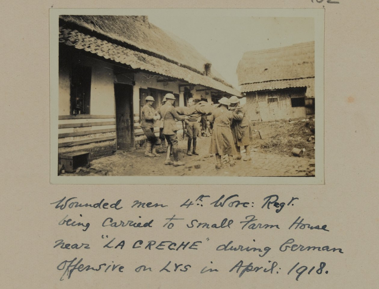 Wounded men, 4th, Worc: Regt. being carried to small farm house near 