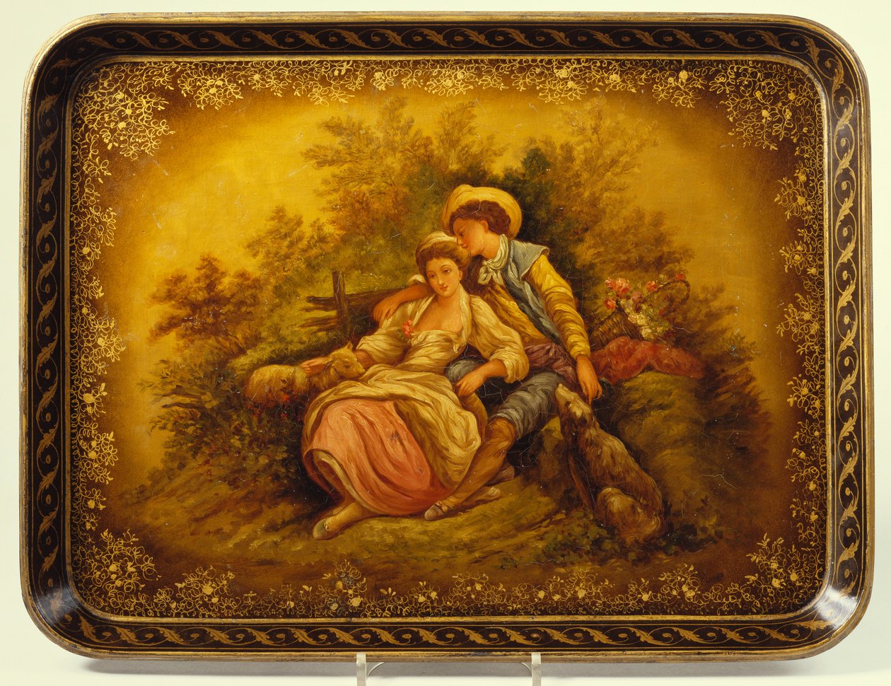 A Mid-Victorian Black Gilt and Mother of Pearl Japanned Papier-Mâché Tray Decorated with a Shepherdess and Lamb with a Young Man by English School