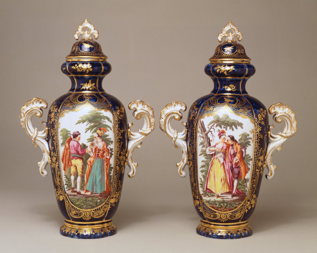 A pair of Chelsea blue-ground lobed tapering oviform vases and covers depicting lovers among trees, c.1765 by English School
