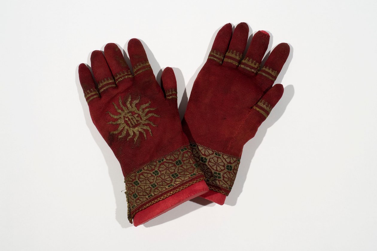 A pair of knitted silk gloves, possibly once belonging to Archbishop William Warham, late 15th or early 16th century by English School