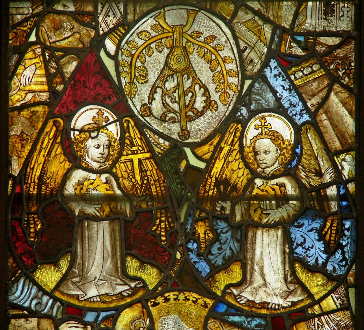 A panel in the east window depicting angels with Passion Instruments amid fragments by English School