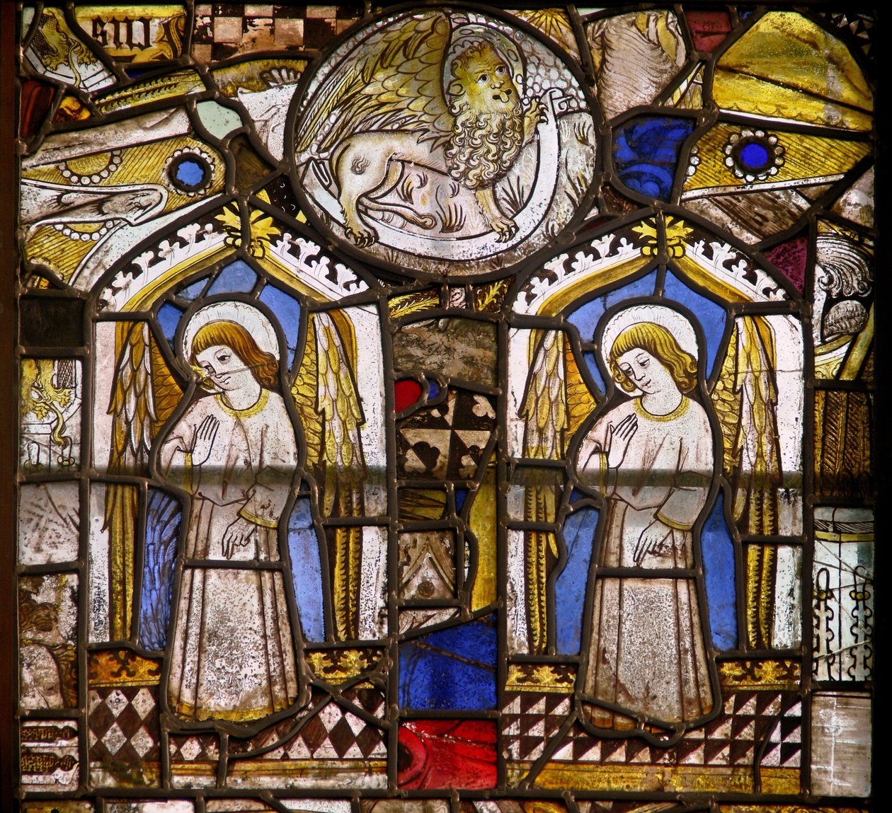 A panel in the east window depicting two angels and St Mark