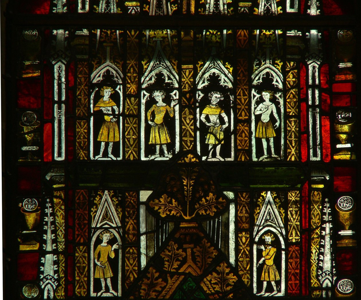 A window in the Lady Chapel depicting canopy figures by English School
