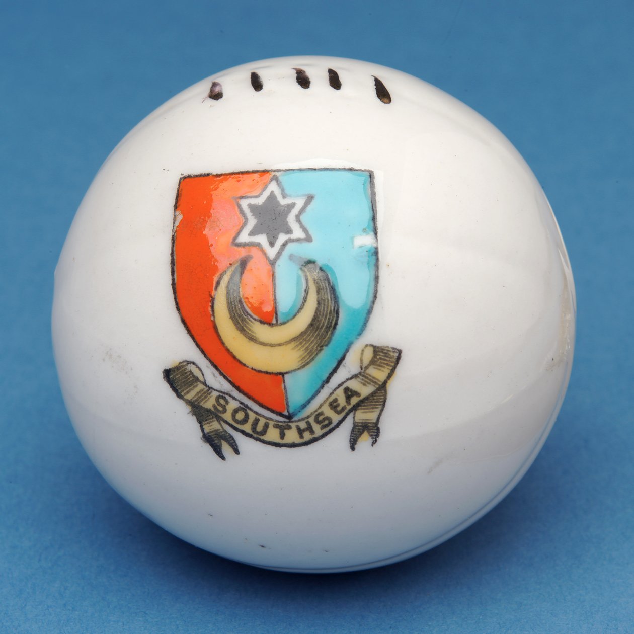 Armorial souvenir miniature football with transfer of the Southsea crest (ceramic) by English School