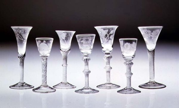 Collection of engraved glasses with opaque and air twist stems by English School