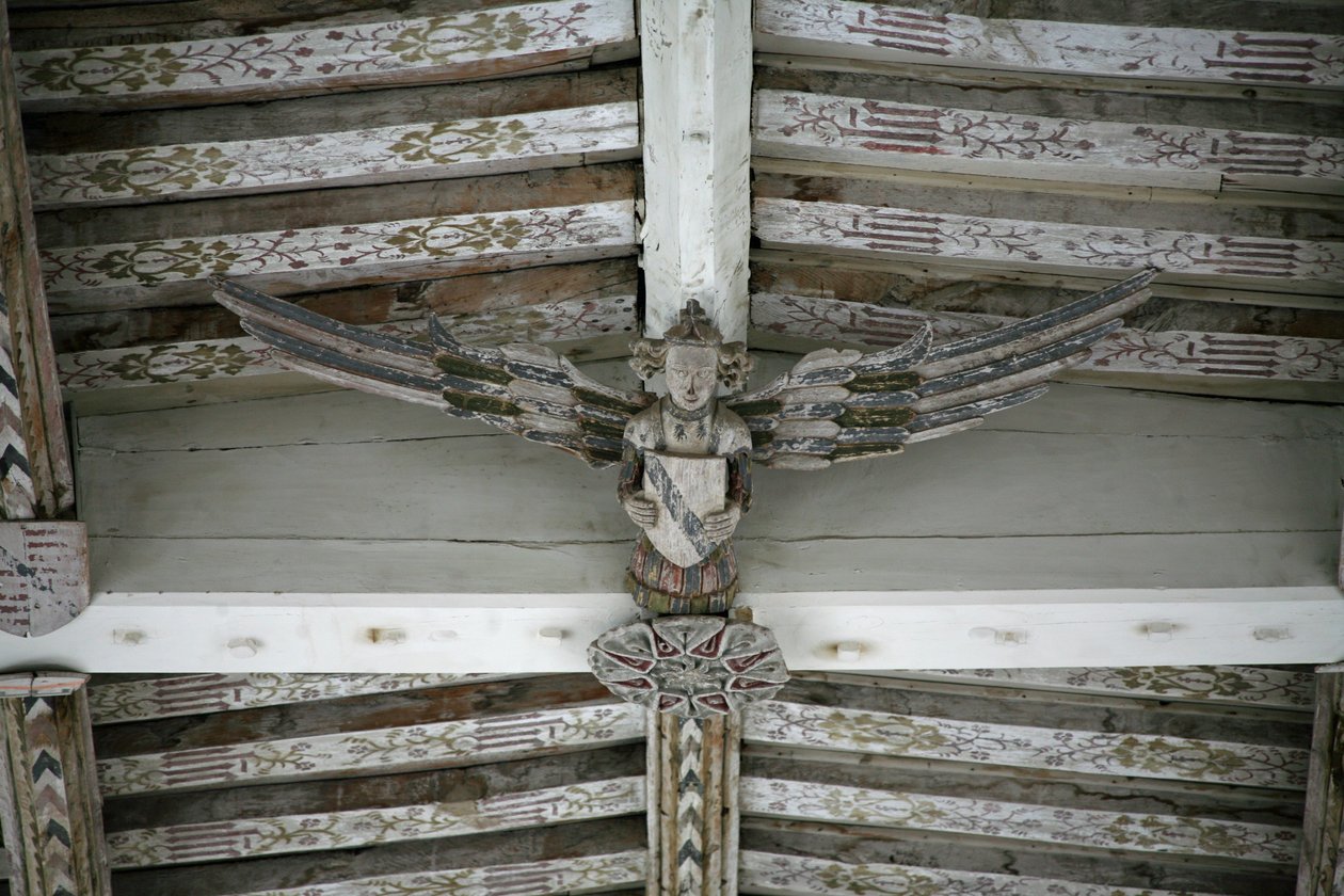 View of one of the carved wooden angels in the nave by English School