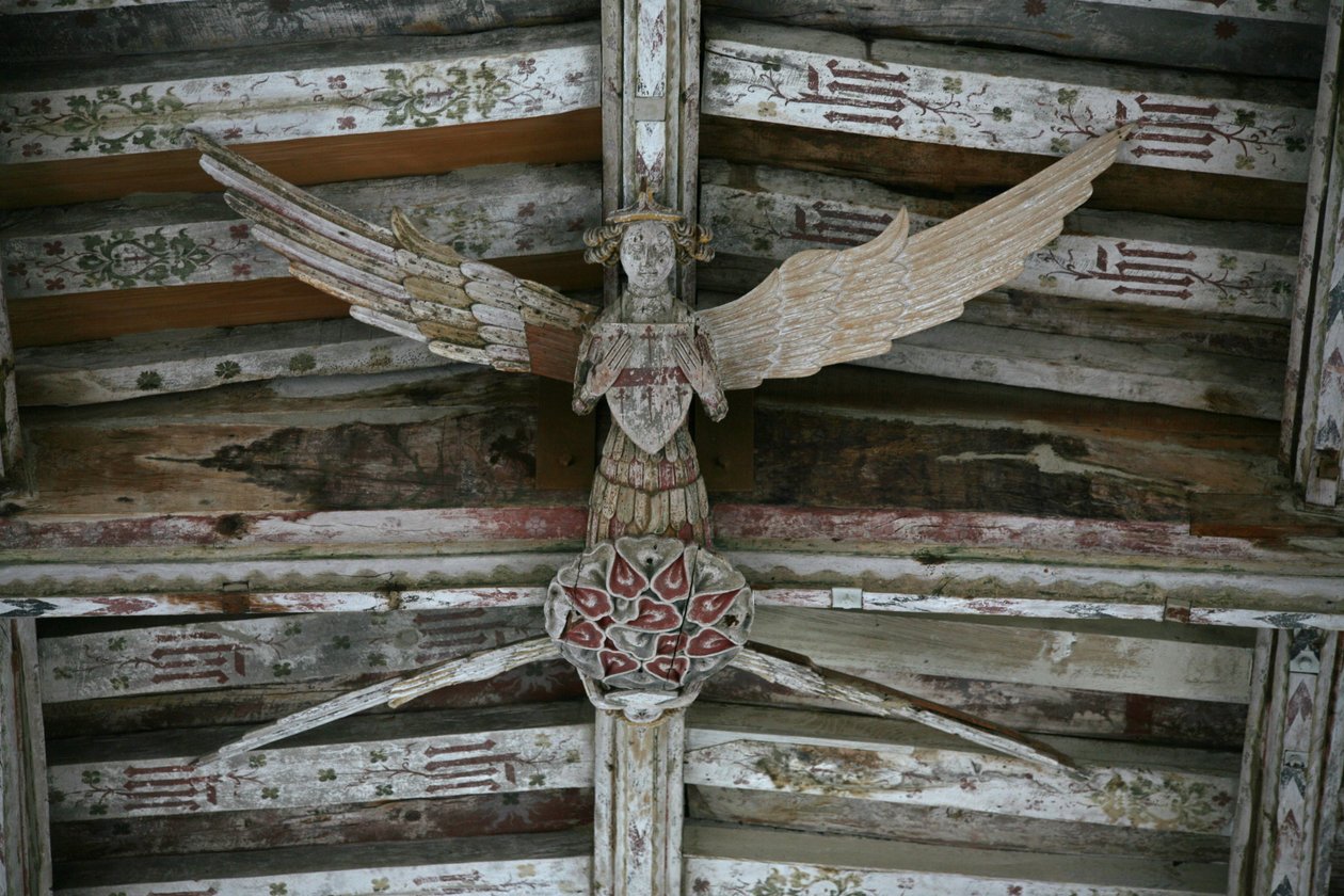 View of one of the carved wooden angels in the nave by English School