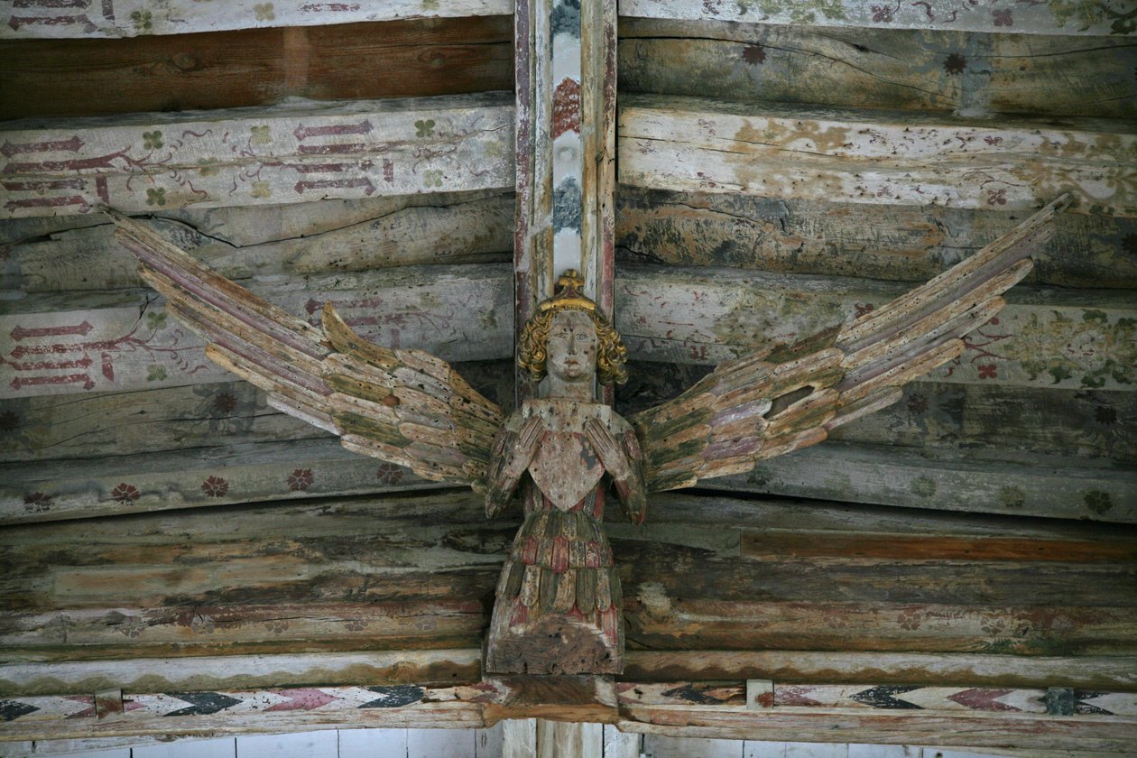 View of one of the carved wooden angels in the nave by English School