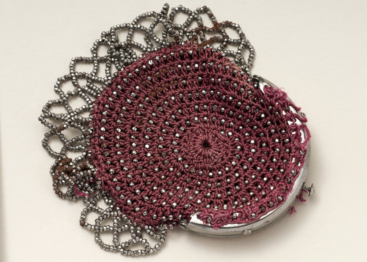 Pink purse with top clasp, bead decoration and mesh trim by English School