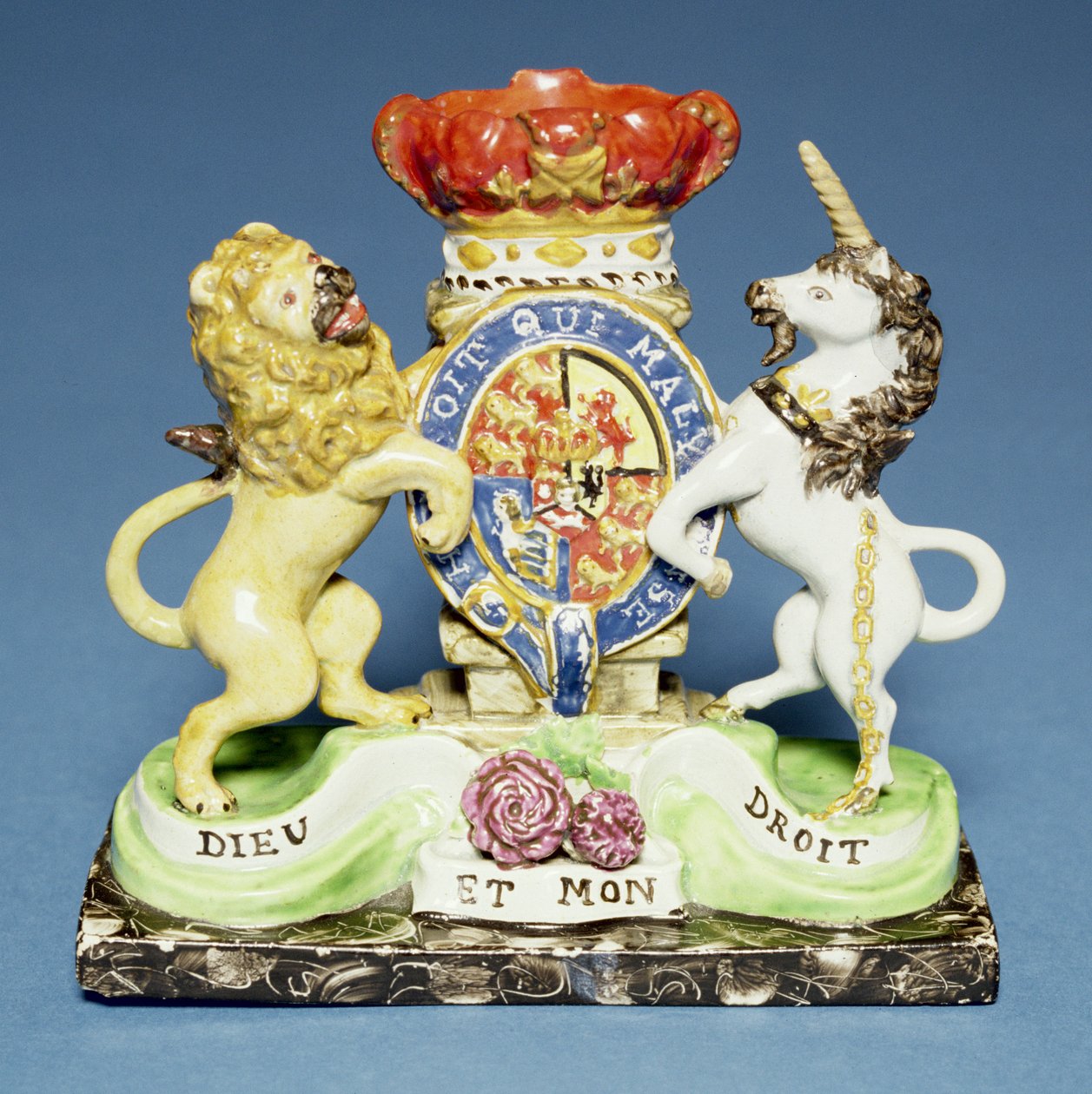 Spill vase, in the form of the Royal Arms on a black marble plinth, Walton by English School