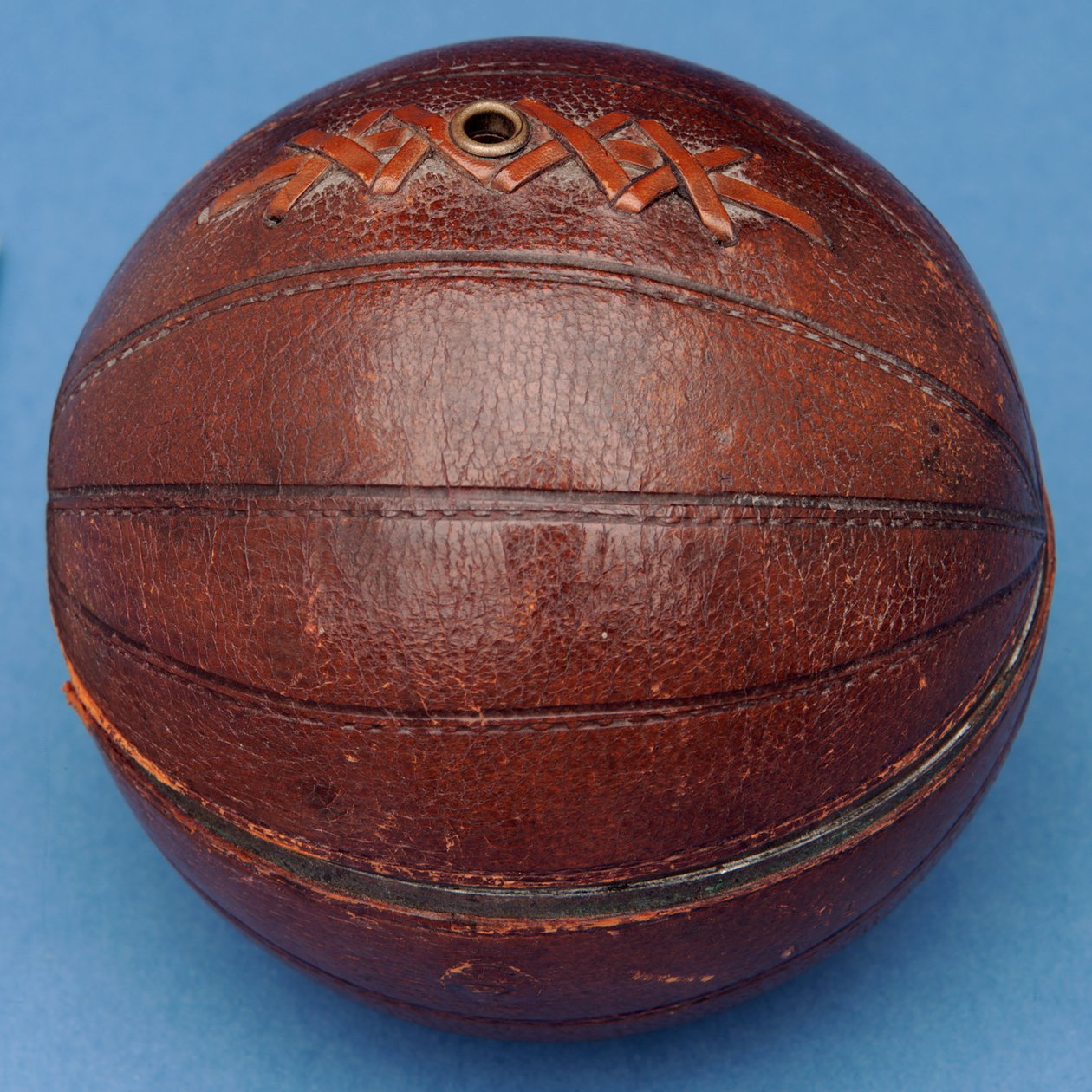 String dispenser in the shape of a football (leather) by English School