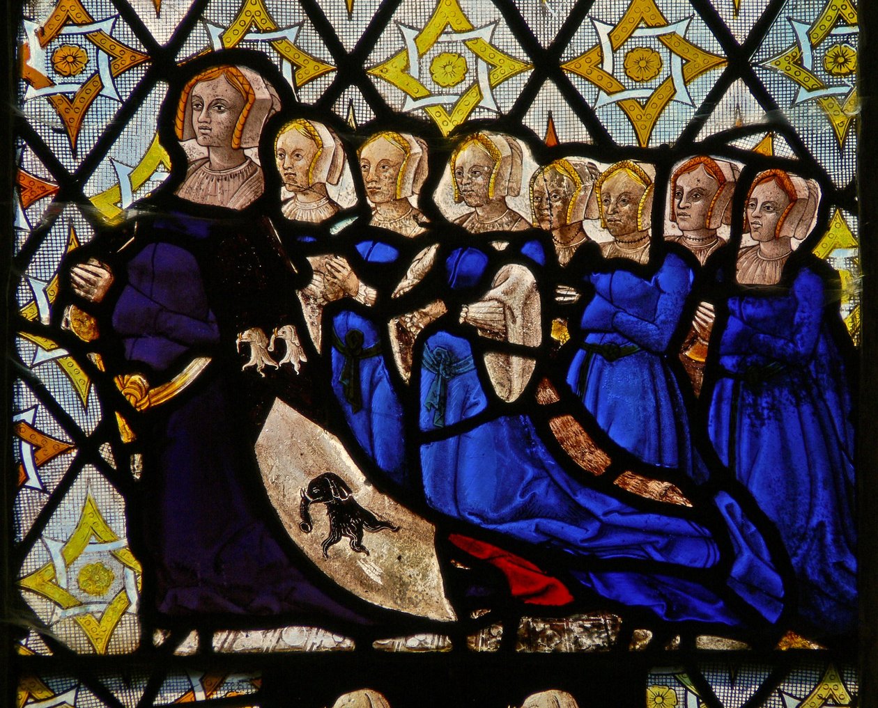 Window depicting Isobel Saunders, wife of Walter Curson and their seven daughters by English School