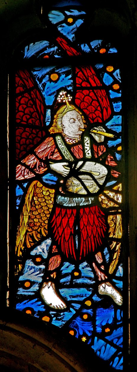 Window depicting a musician angel with pipe and tabor by English School