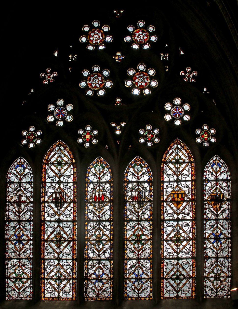 Window s5 depicting geometric grisaille and roundels in the tracery lights by English School