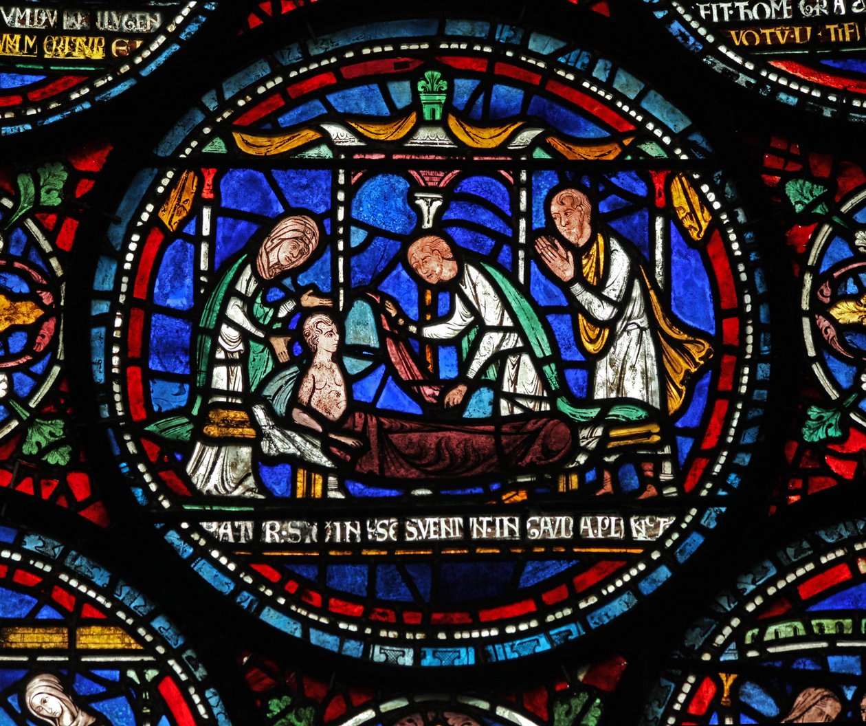 Window 6 depicting a scene from a St Thomas Becket Miracle window: Cicely of Plumstead sits up on her bier by English School
