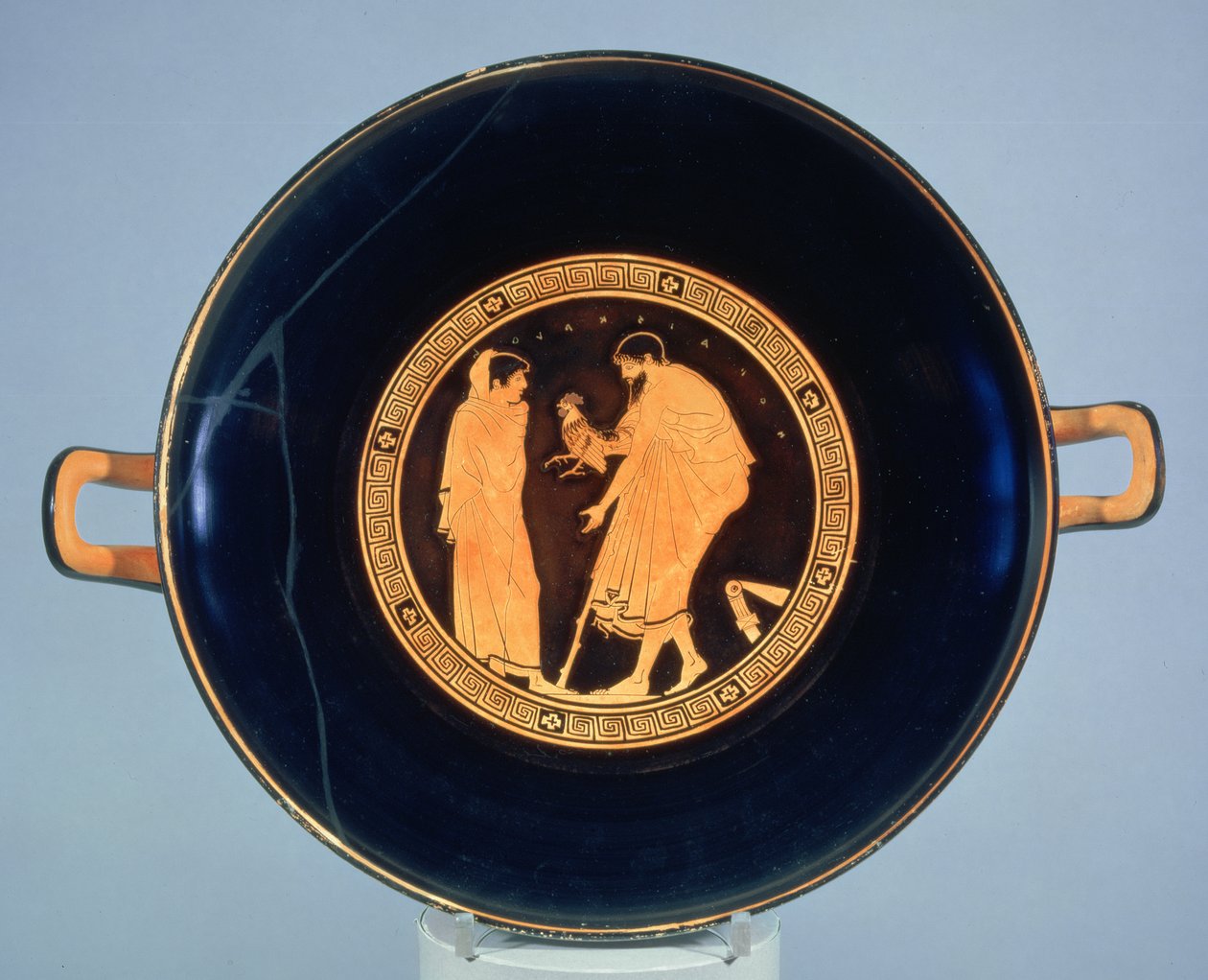 Attic red-figure cup decorated with a man giving a boy a cockerel, c.470 BC by Euaichme Painter