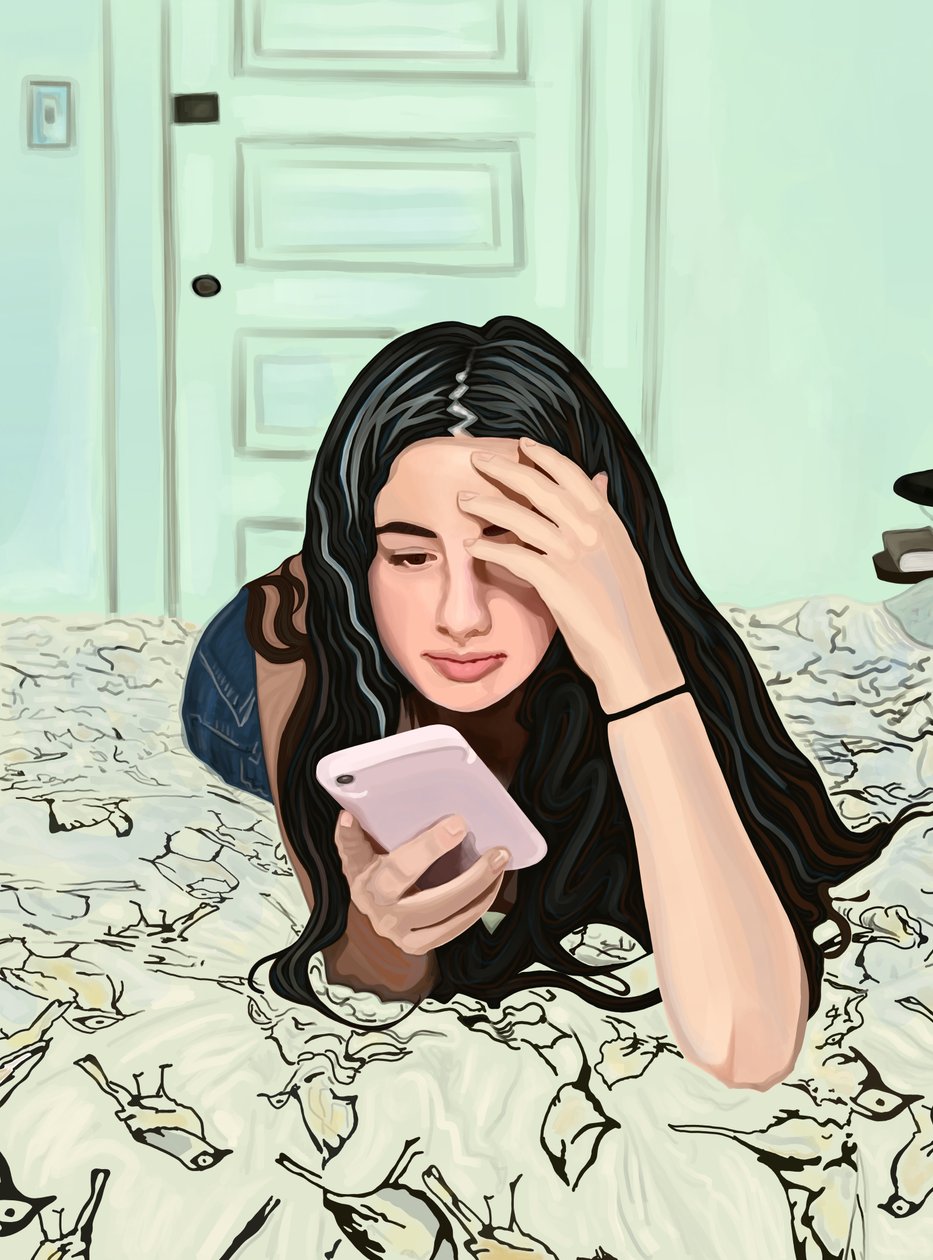 Girl On Bed Looking At Smart Phone by Evan Sklar