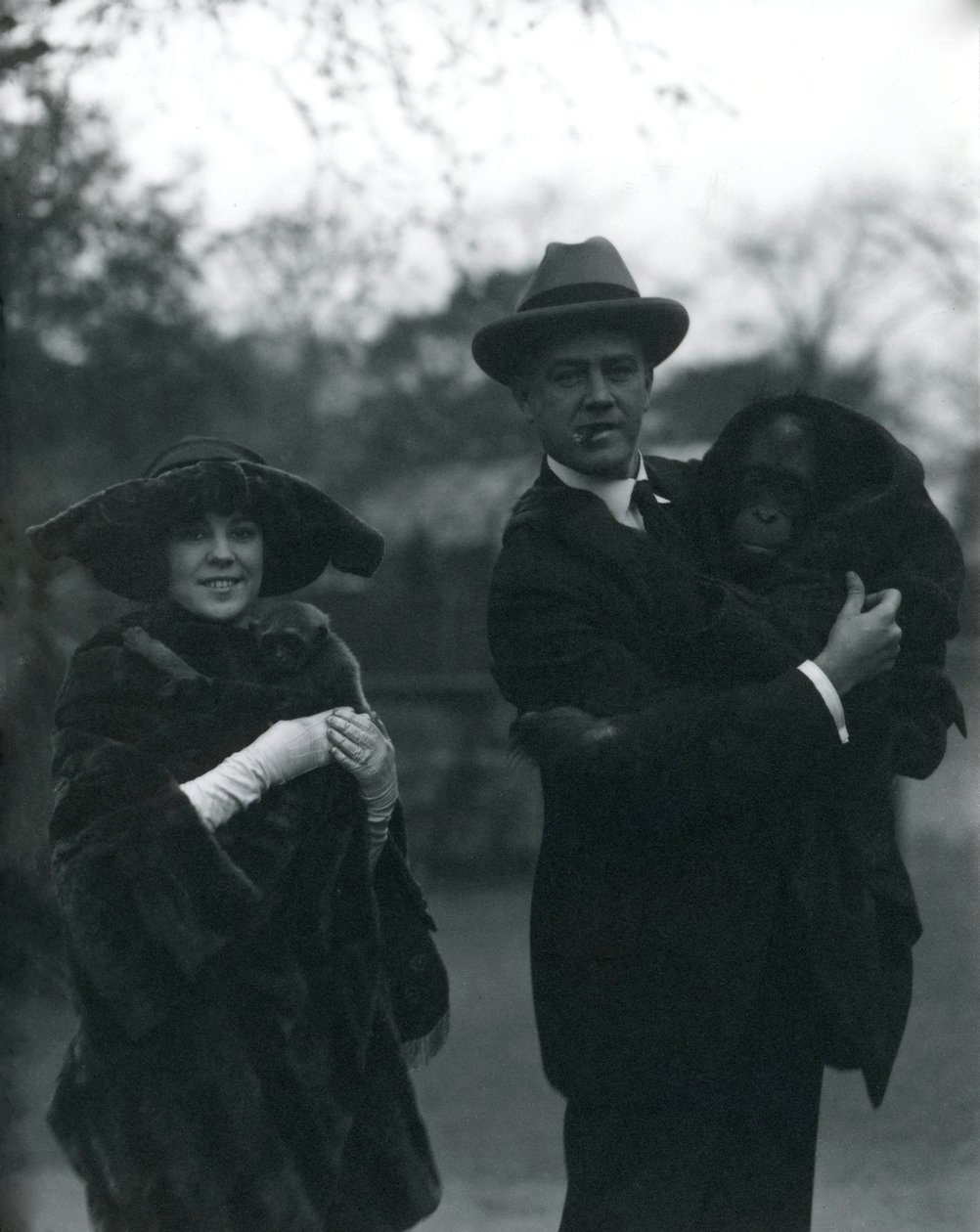Osa and Martin Johnson with an Orangutan and Gibbon, London Zoo, October 1920 by Frederick William Bond