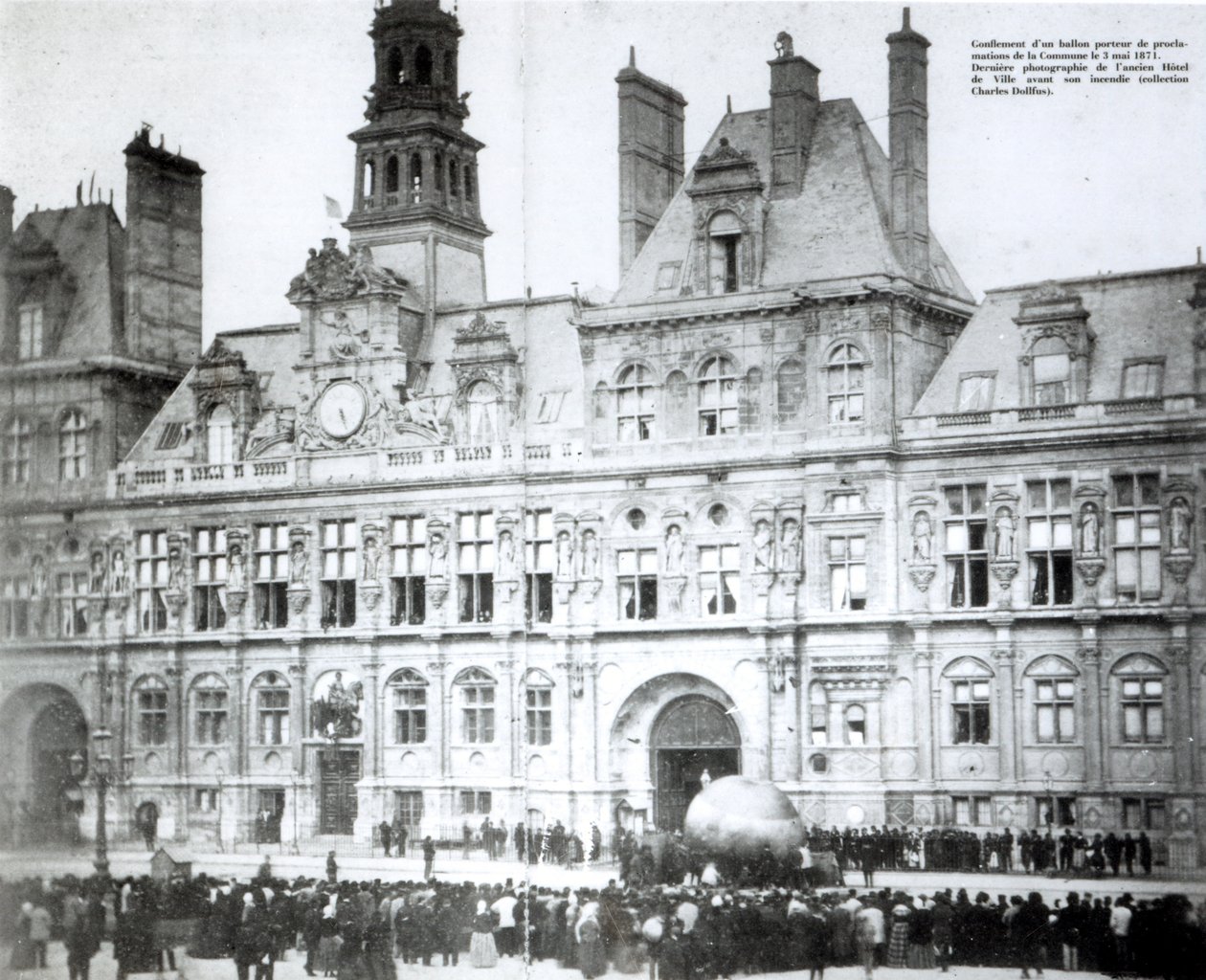 Inflating a balloon with the declarations of the Commune attached to it outside the Hotel de Ville, Paris by French Photographer
