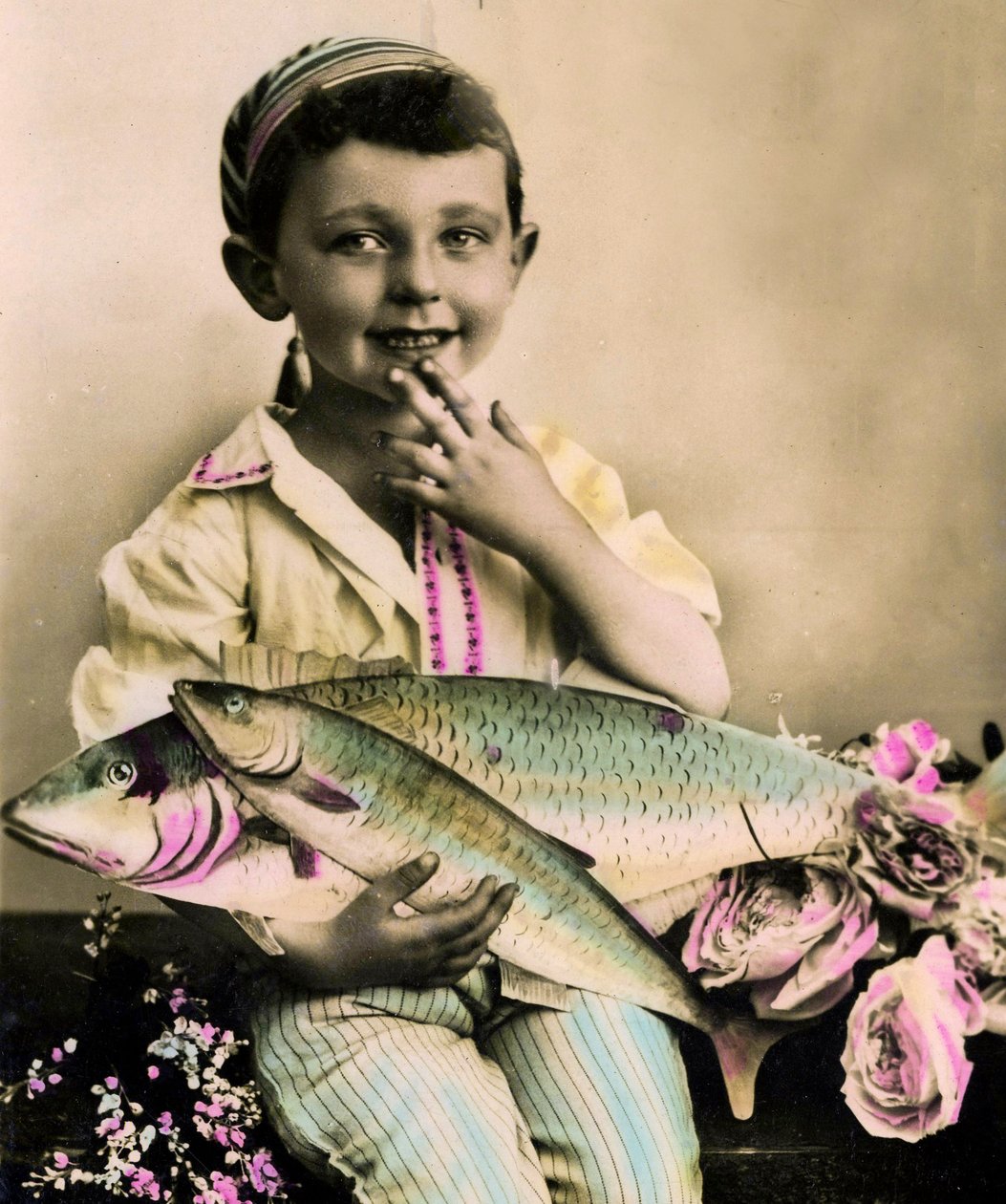 Portrait of a boy holding a fish c.1898 by French School