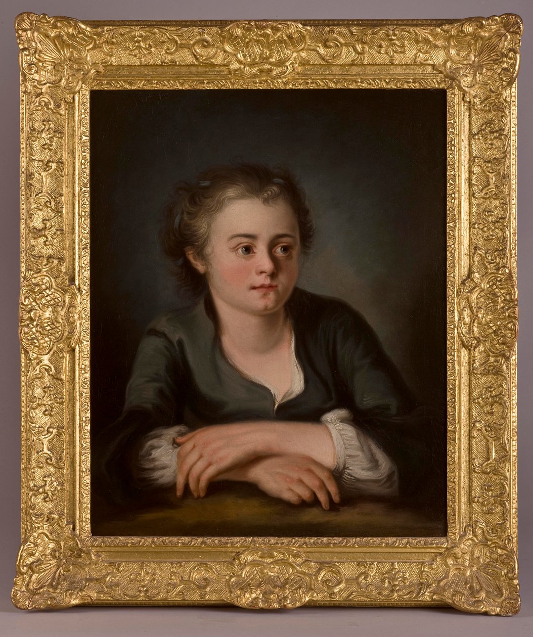 Portrait of a young girl, wearing a green dress and white chemise, seated before a table by French School