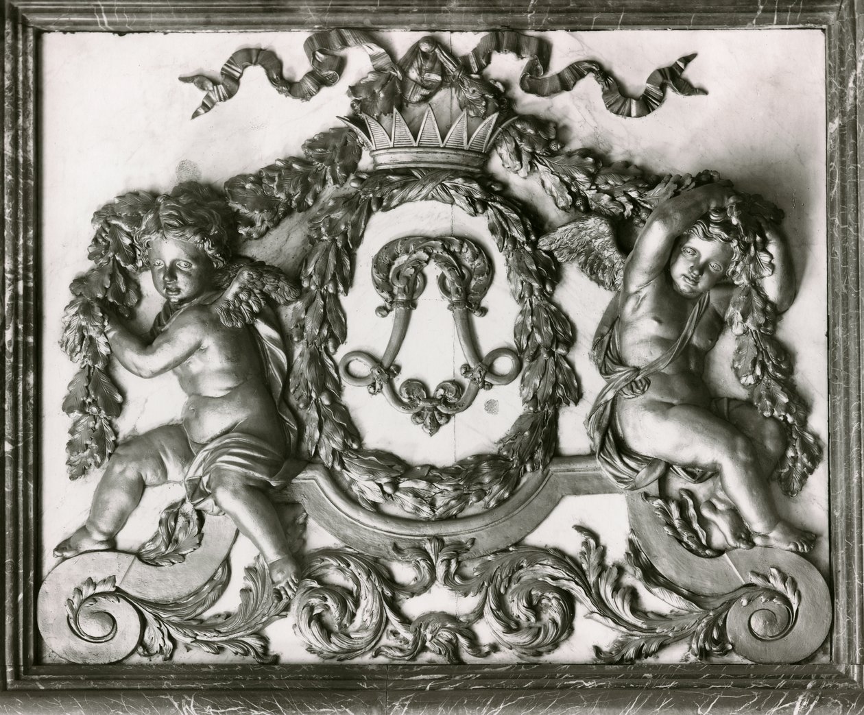 Putti flanking the initial L on the door of the Salon des Gardes de la Reine by French School