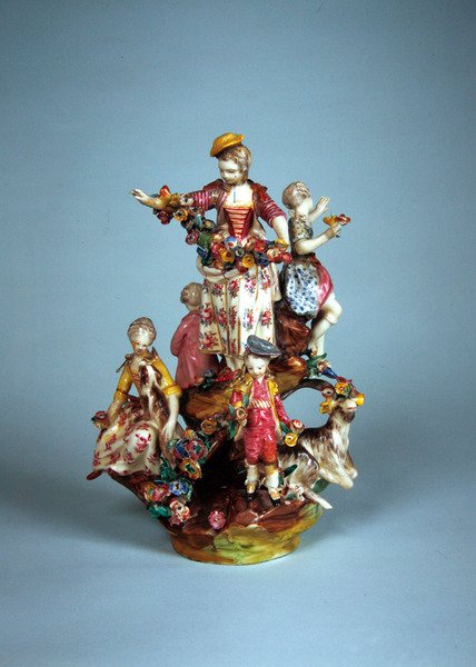 Statuette of women and children grouped on a rockery by French School
