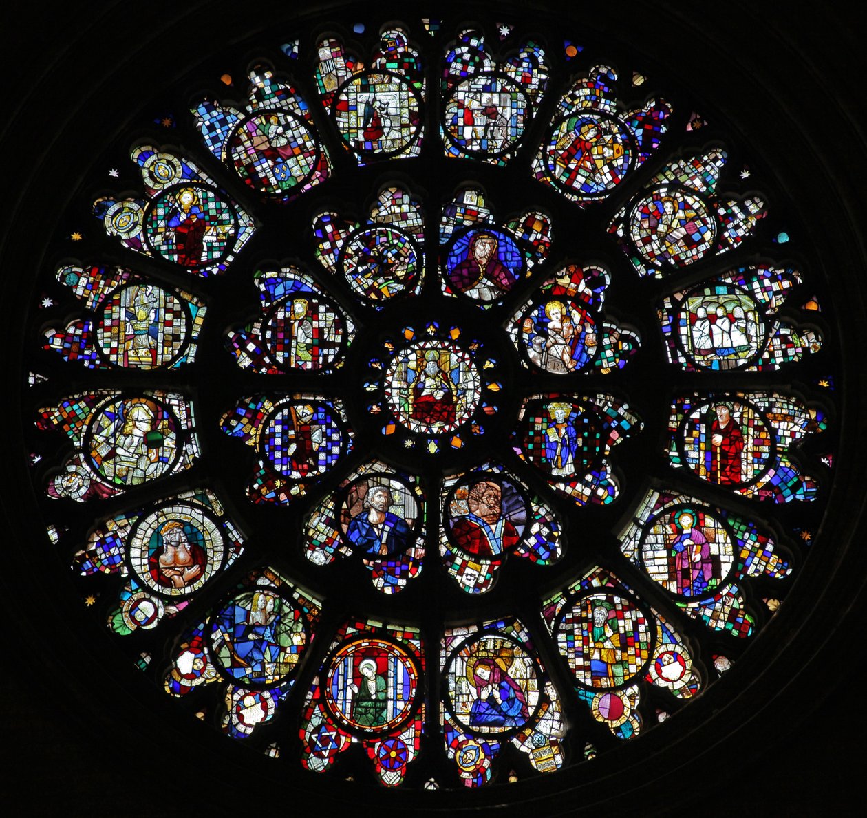 The west rose window with fragmentary fifteenth and sixteenth panels mostly depicting saints by French School