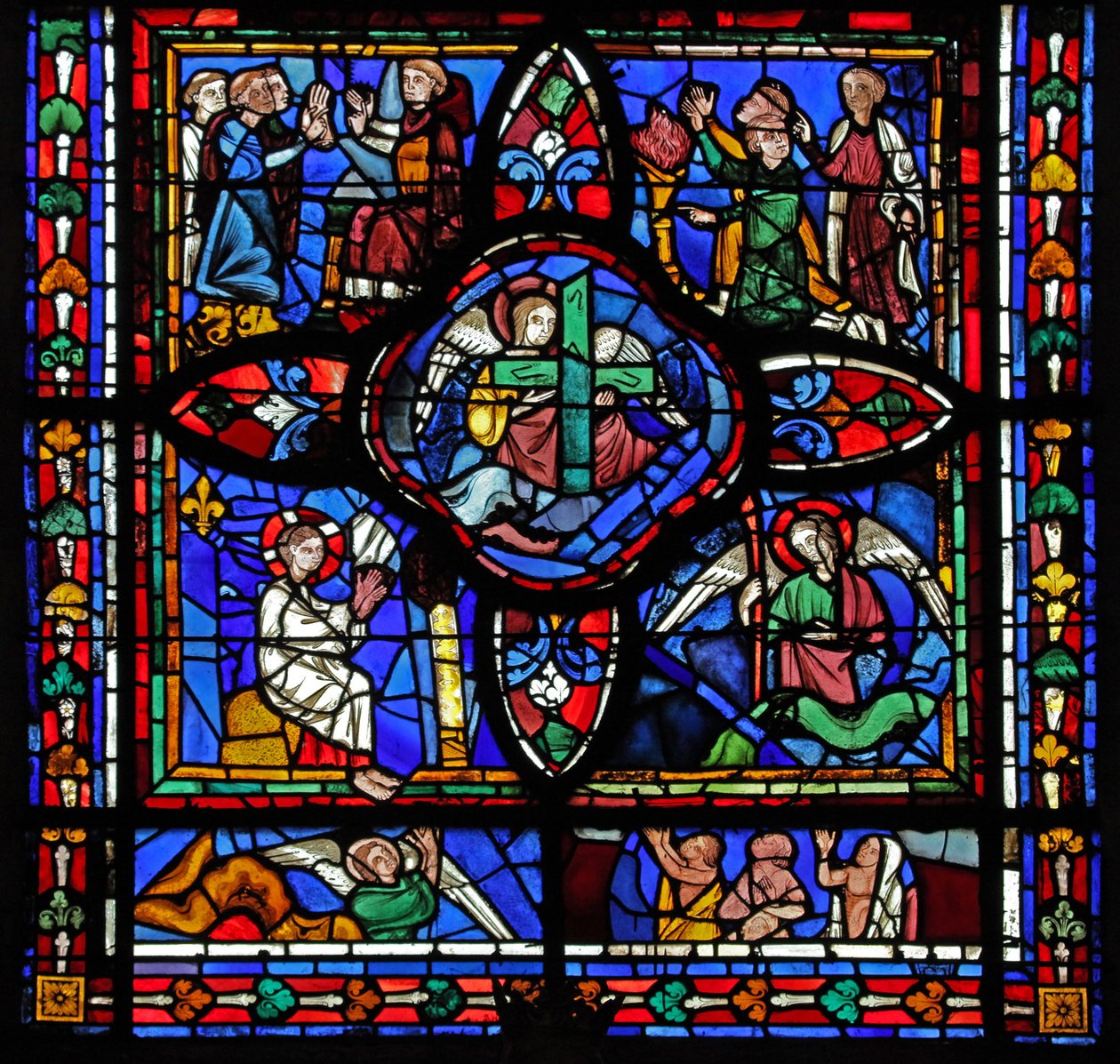 Window depicting the first section of window w7; At the centre are Relics of the Passion (the Cross and Spear); elsewhere are disputing monks and interpolated panels of the Last Judgement by French School