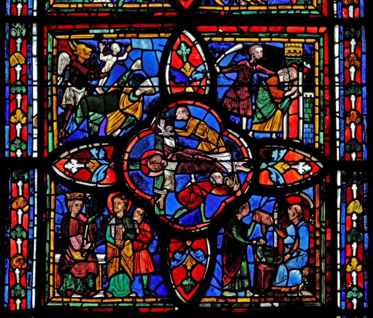 Window depicting the second section of window w7: at the centre is the crucifixion of St Peter; elsewhere is St Peter before Nero; St Peter imprisoned; the devil takes a soul by French School