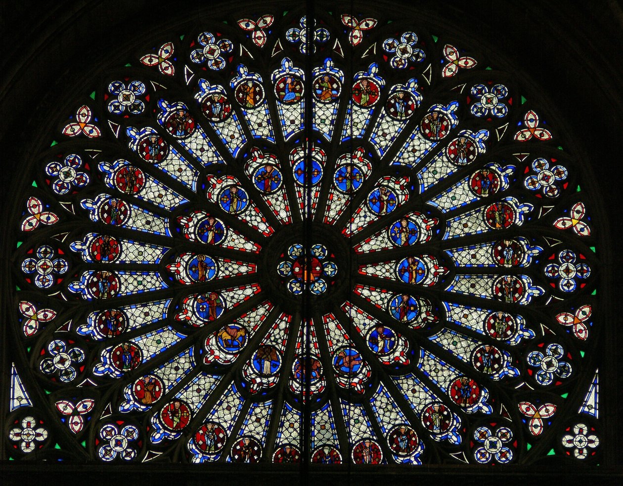 Window w121, the north rose window, depicting Apostles, Evangelists, bishops, kings, martyrs, St Peter and St Paul (rose window - internal) by French School