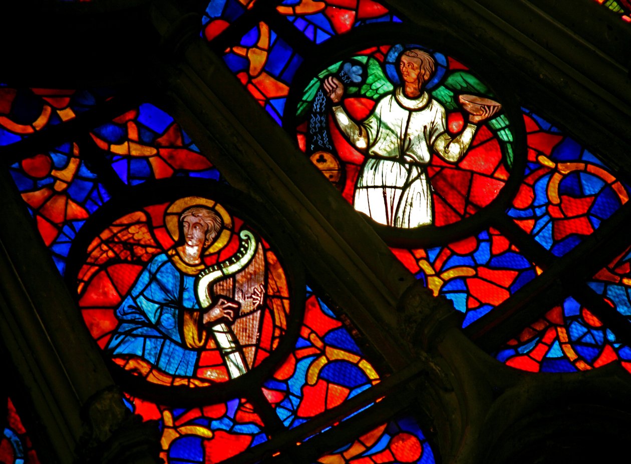 Window w141 depicting a musician angel with a harp and other angels by French School
