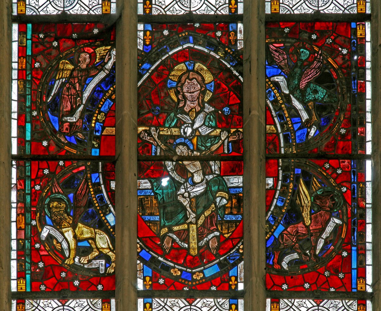 Window depicting the Trinity surrounded by the emblems of the Evangelists by French School