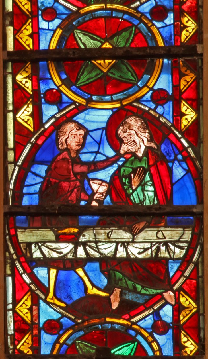 Window w213 depicting a scene from the life of St Thomas: the saint at a marriage banquet for the daughter of the king of India has his face slapped by a cupbearer by French School