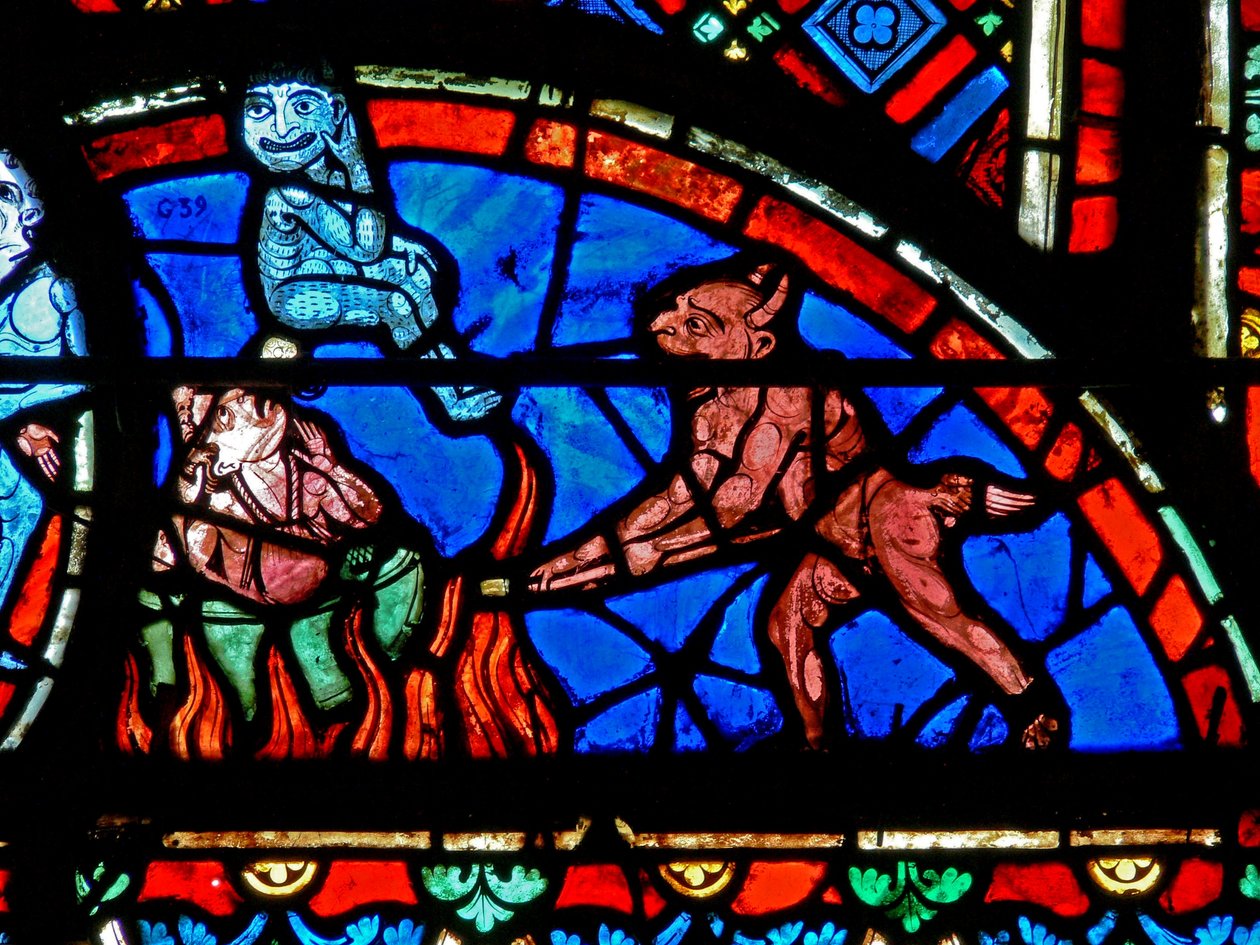 Window depicting an impenitent being tormented by demons by French School